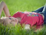 Lying on a field of grass