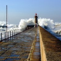Waves Cracking Lighthouse