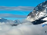 Para Sailing over Snowy Mountains