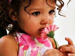 Cute baby with pink flower