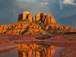 reflection of rainbow and cathedral rock formation