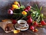 Colorful tulips and cup of tea