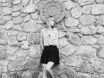 girl infront of a sandstone wall