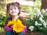 Girl Holding Sunflowers