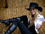 Cowgirl Relaxing on Straw Bales