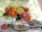 Multicolored roses and tea