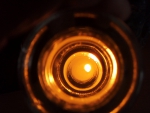 Bottom of the bottle candle reflecting