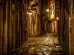 beautiful stone alley in venice at night