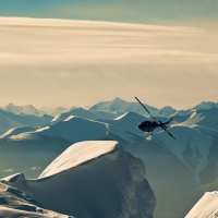 Helicopter Over Mountains by Neal Rogers