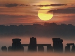 stonehenge in fog at sunset
