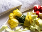 Gift and yellow tulips for you