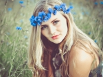 Beauty with a wreath of blue flowers