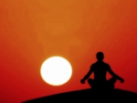Meditating at sunset