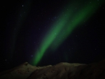 Northerns Lights over snowcapped mountains
