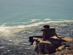 Awesome Picture of a Man Sitting on a Cliff Ledge in Cape Town