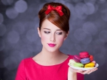 Girl with bow and macarons