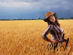Cowgirl In A Field
