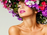 Bunch of flowers on the head of a beautiful girl