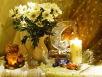 White chrysanthemums and candle