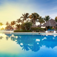 Tropical swimming pool at sunrise
