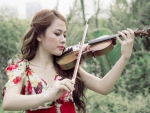 Asian girl playing a violin
