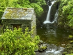 Stone Hut by a Waterfall