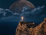 Moon over a Lighthouse