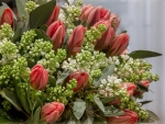 Bouquet of red tulips and white lilac