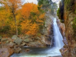 Autumn Shades by the Rocky Waterfall