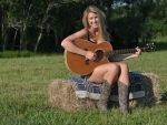 Cowgirl Playing the Guitar