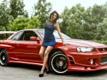 Red Nissan Skyline R34 and a Model