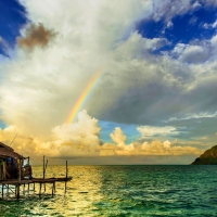 Rainbow over Tropical Beach Bungalow