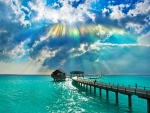 Colorful sun rays over the sea