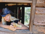 Cowgirl With A Golden Pistol. .