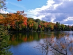 Autumn Clouds Over A Lake