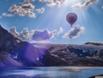 Hot Air Balloon Over Mountains