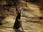 Girl in a Black Dress is Standing on the Road,