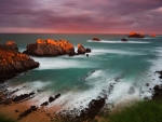 Rocky Coast of the Ocean in Cloudy at sunset