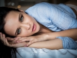 Model Angelina Petrova lying on the bed