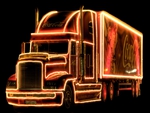 lighted coke truck in the dark