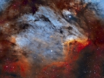 The Pelican Nebula in Gas, Dust, and Stars