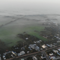 The field is engulfed in fog