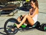 Riley Reid having fun on a tricycle