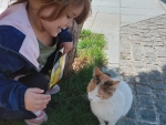 Little girl and cute cat