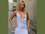 Blonde model in low cleavage mini dress