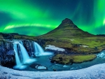 The breathtaking Kirkjufellsfoss in Iceland under the Northern Lights