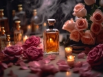 Perfume bottle and roses