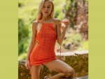 NANCY ACE IN AN ORANGE MINI DRESS