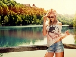 Blonde by a river