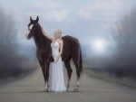 blonde model with a large horse